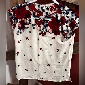 White blouse with red and blue flowers. Size small
